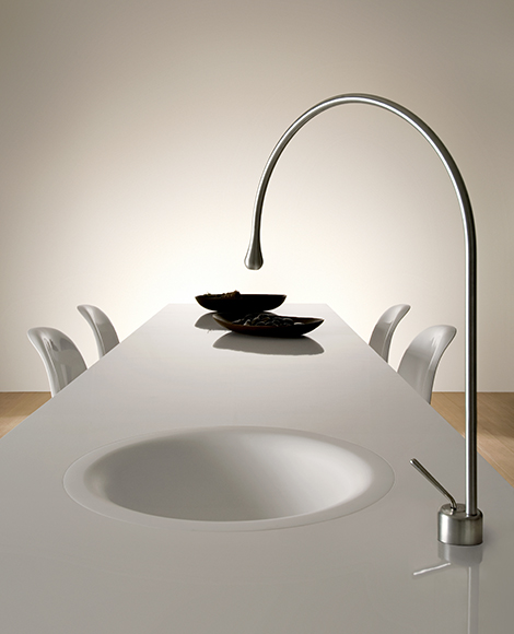 Goccia Kitchen Faucet by Gessi is built into the dining table